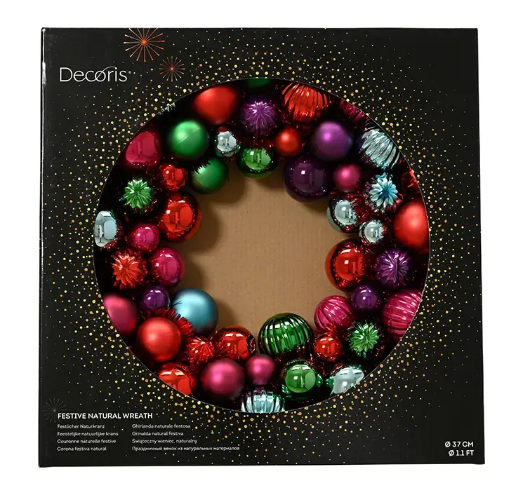 Julekugle krans af plast med et mix af farver vist i æske
