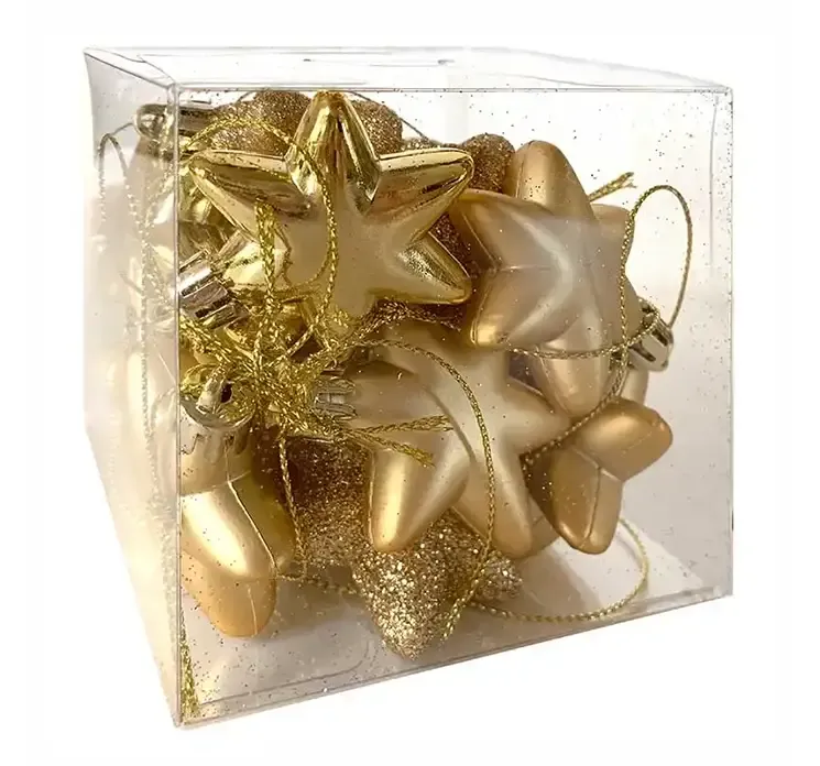 Små stjerner i guldfarvet af plast med ophæng i æske