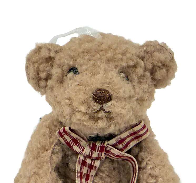 Bamse også kaldet teddybear i lysebrun plys med sløjfe til ophæng closeup