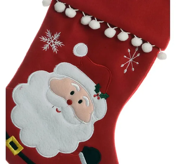 Julesok i rød filt med julemandsmotiv closeup