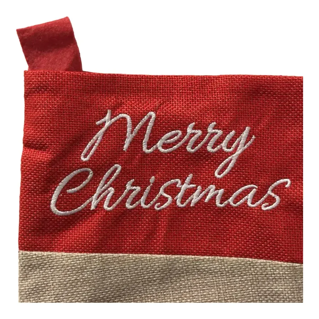 Julesok med snemands motiv og teksten merry christmas i stof closeup af tekst