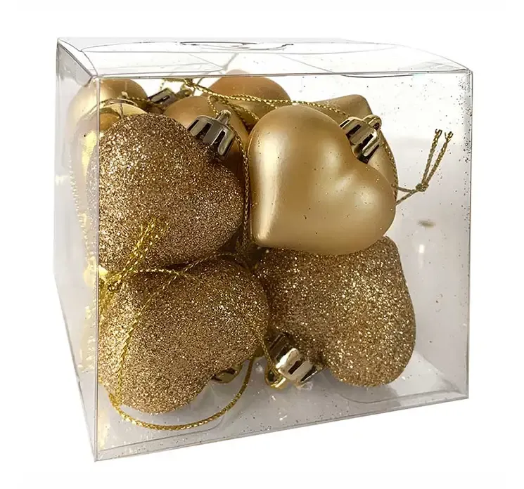 Hjerter af plast i guld farvet med ophæng til juletræet æske