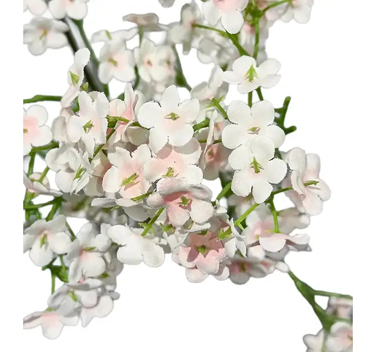 Kunstig brudeslør blomstergren med lyserøde blomster closeup