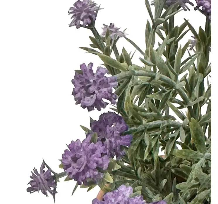 Kunstig brudeslør blomst i lilla i potte closeup