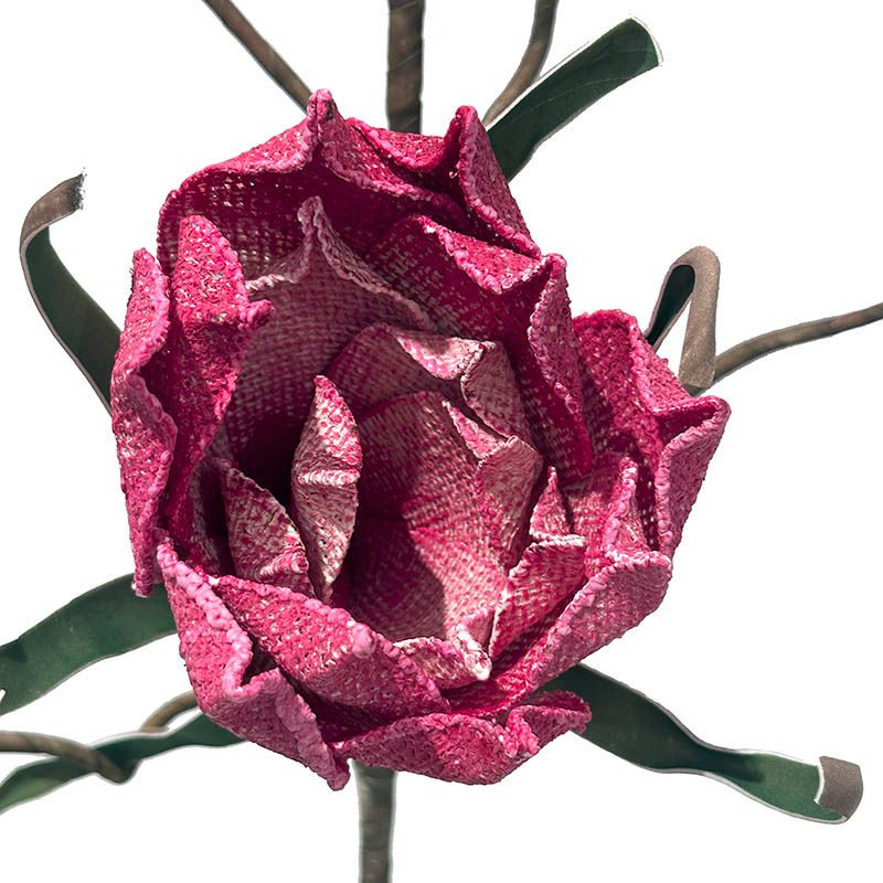 kunstig magnolie blomstergren af jute i pink closeup