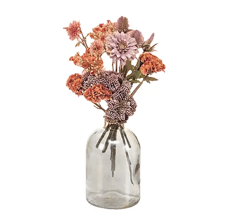 Blomster buket af kunststof i lilla og orange farver i gaveæske har vist i klar vase