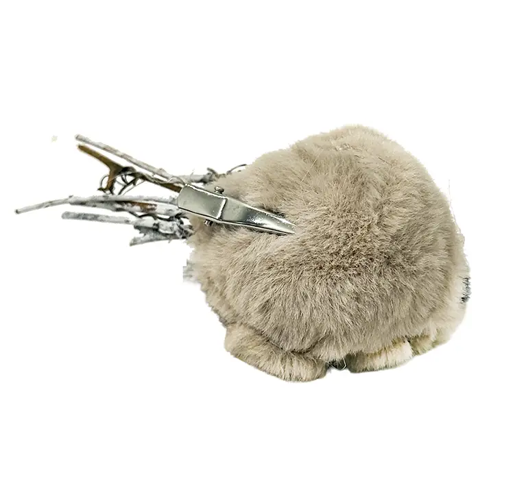Fugl på clips i beige clips vist på maven