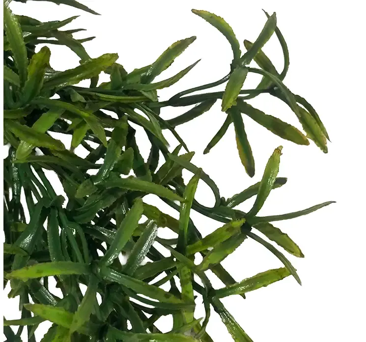 Kunstig græshænger i grøn af plast closeup