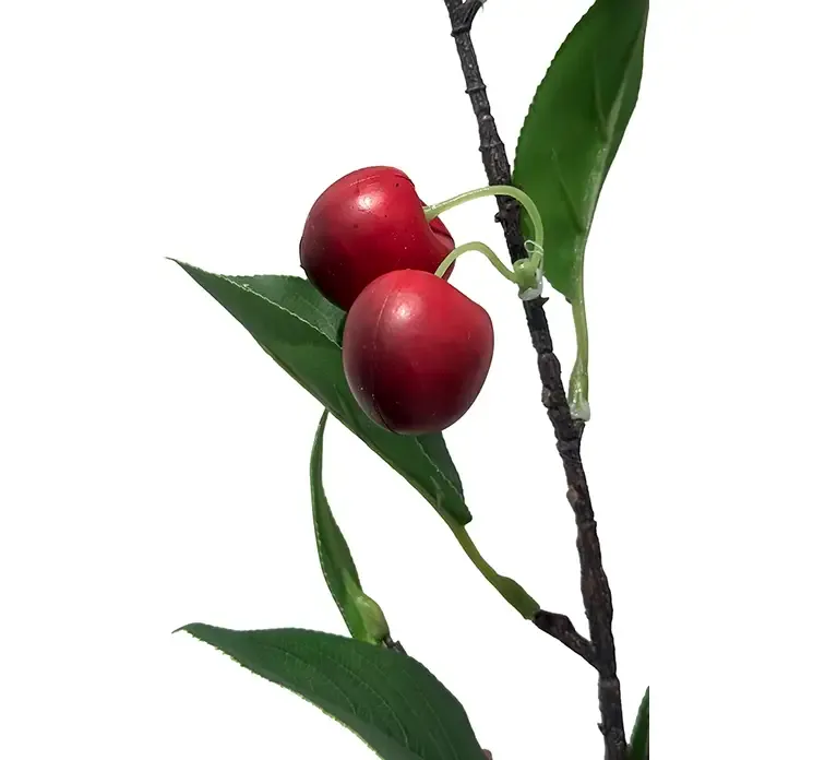 Kunstig kirsebærgren af plast closeup af bær