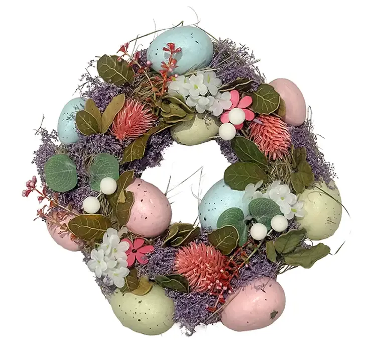 Kunstig forårs påskekrans med æg og blomster af plast i flere farver