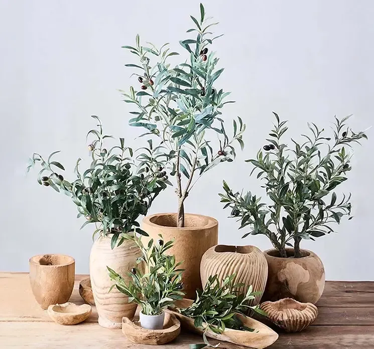 Oliven gren af kunststof og plast i grøn kunstig gren vist i miljø andre kunstige oliven planter