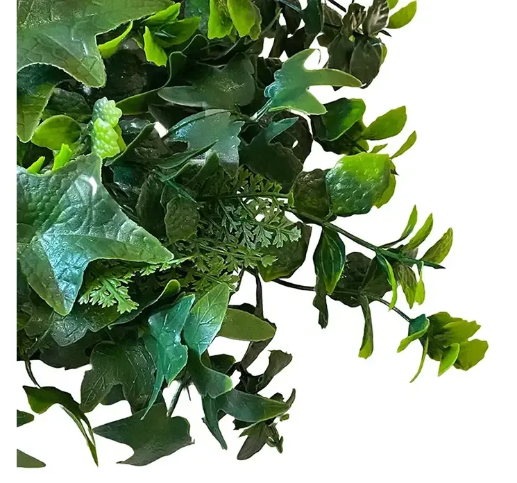 kunstig bladmix plade i grøn af plast uv beskyttet closeup