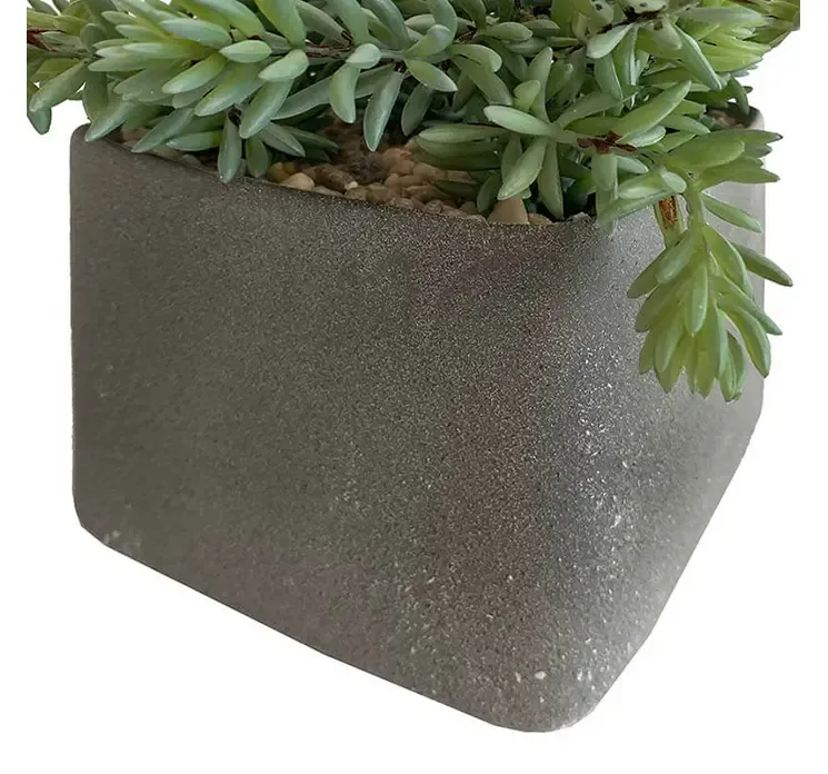 Kunstig sukkulent plante af plast i firkantet krukke closeup af krukke