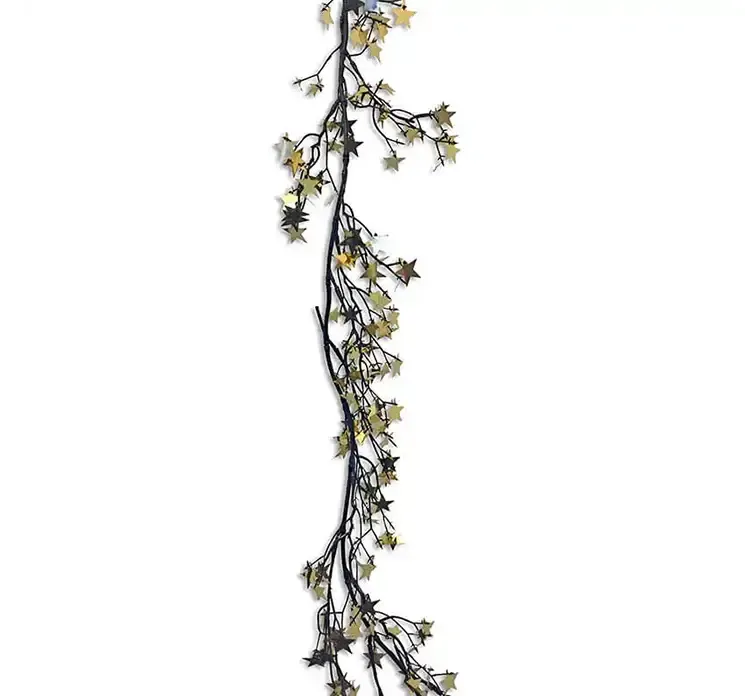 Ranke med små stjerner i guld plast closeup