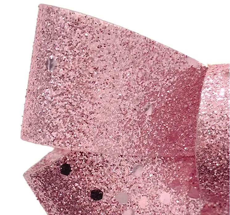 Sløjfe i lyserød af plast med glimmer closeup